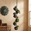 suspension de petits pots en terre cuite - Décoration murale
